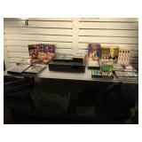 VCR and assorted VHS tapes