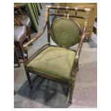 5 green padded wooden armchairs
