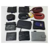 Assorted small billfolds and coin pouches. Some