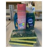 Assorted household cleaners and sponges.