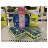Assorted household cleaners and sponges.