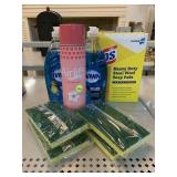 Assorted household cleaners and sponges.