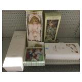 6 NIB collectible dolls in boxes.