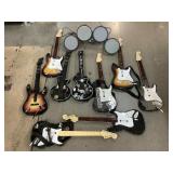 Collection of a guitar hero guitars and drum, for