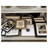Assorted framed prints.