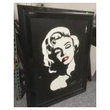 Damaged Marilyn Monroe print on canvas. Framed to