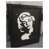 Damaged Marilyn Monroe print on canvas. Framed to