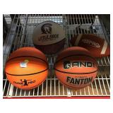 4 sports balls. Basketball, football