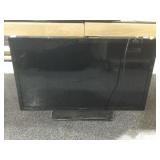 Emerson LED TV on stand.