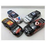 4 die cast model race cars.