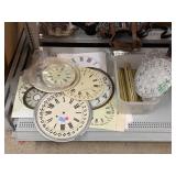 Assorted clock parts incl. faces and weights,