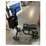 Metal folding knee cart w/helmet, missing bolt to