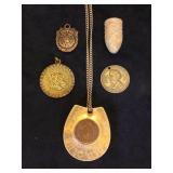 Assortment of vintage sterling coin pendants,