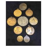 Assortment of metal pendants,