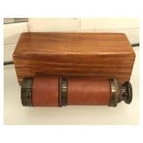 Brass and leather spyglass with wooden case and