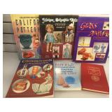 Assortment of collector guide books coins, dolls,