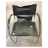 Modern chrome and faux-leather chair - some wear