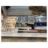 Assorted License Plates, X.B.G., and Tool.