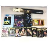 2 sealed DVDs, assorted VHS tapes, teddy ruxpin