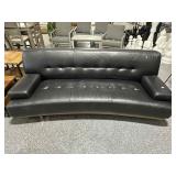 W.Schillig Black leather armchair, approx 90in
