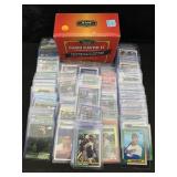 Mixed sports card lot in cases