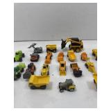 Small toy trucks and tractors. Assorted.