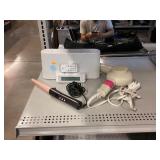 Sony clock radio with dock and hair tools.
