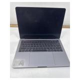 Apple laptop with charger. Powers up. No icloud.