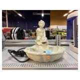 Composite Water fountain decor feature. Child on