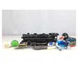 Lionel metal train engine, ceramic duck, paper