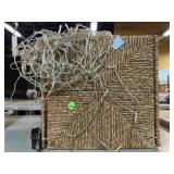 Decorative rattan bin and string lights