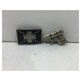 Belt buckle and novelty gun.