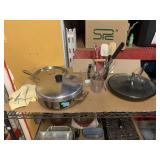 Tramontina lidded pan, measuring cups, kitchen