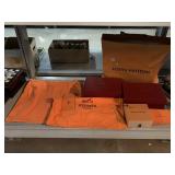 Empty designer brand dust bags and boxes.