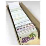 Box of assorted casino members playing cards.