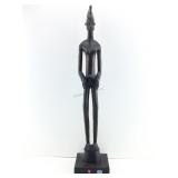 Dark Brown, hand carved wooden statue originating