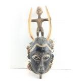 Yaure  mask with standing  child figure holding