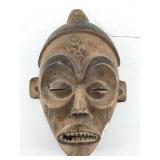 Zira small wooden mask w closed eyes. 7 X 10In