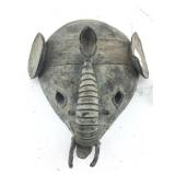 Stylized African head mask that resembles