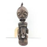 Wood carving of a Songye fetish figure from the