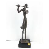 This is a vintage bronze brutalist flute player