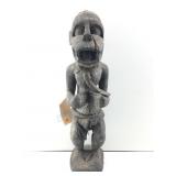 A carved wooden Monkey figure associated with the