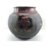 This Item is a handmade raku fired ceramic vessel