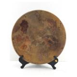 This is a large shallow decorative ceramic bowl