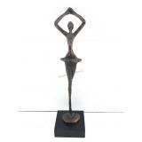 A stylized mid century modern bronze ballerina
