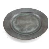 This item is an antique pewter charger plate
