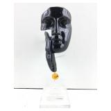 This is a black fractured face abstract sculpture