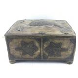 This decorative metal box likely features designs