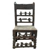 This is a Chokwe chiefs chair featuring intricate