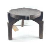A carved wooden 3 legged stool from the Hehe